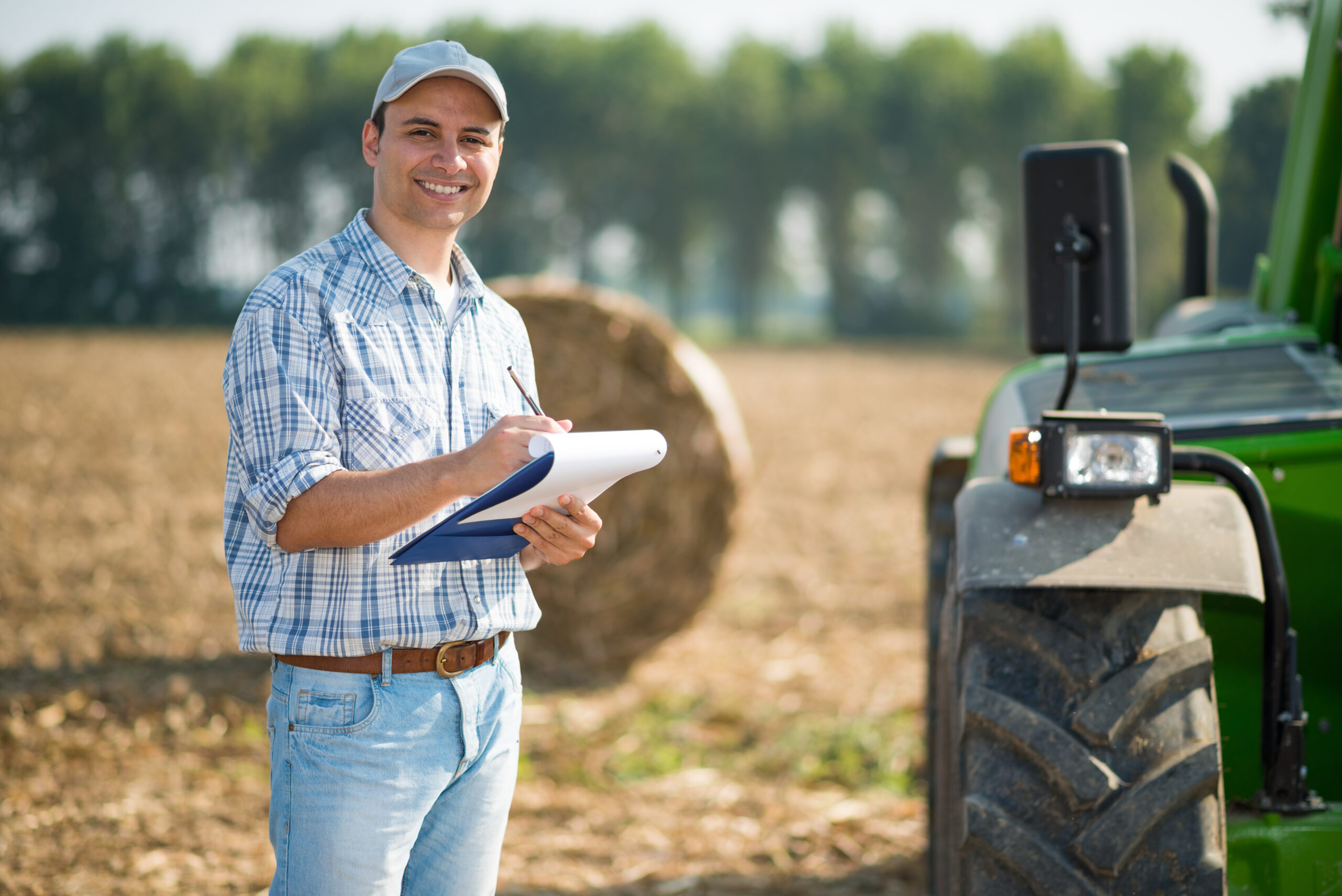 Farmer writing on a document